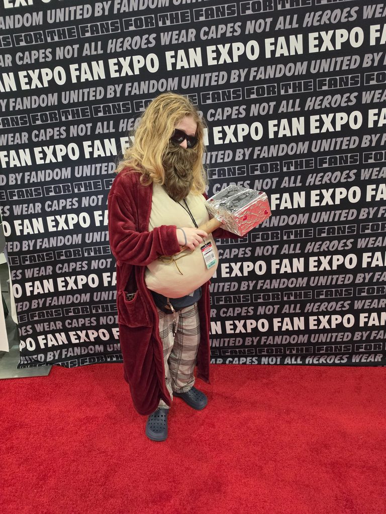 Me dressed as Fat Thor from Avengers Endgame, cradling a tribute to Mjolnir.