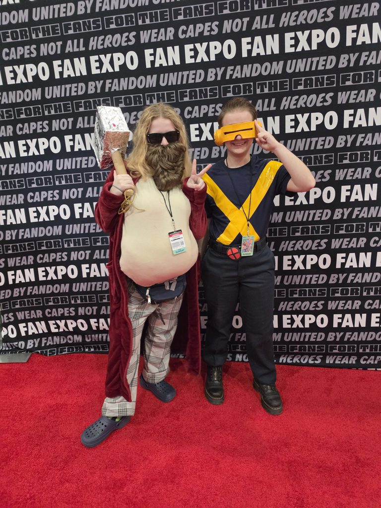 Me dressed as Fat Thor from Avengers Endgame, cradling a tribute to Mjolnir. 